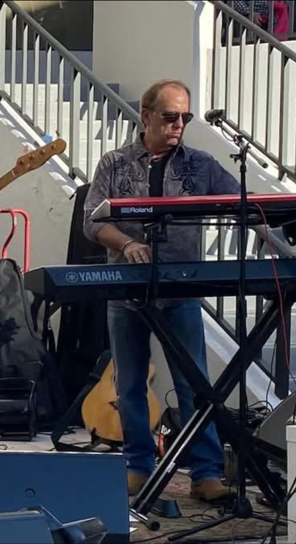 Chris Sisson at his keyboards on stage