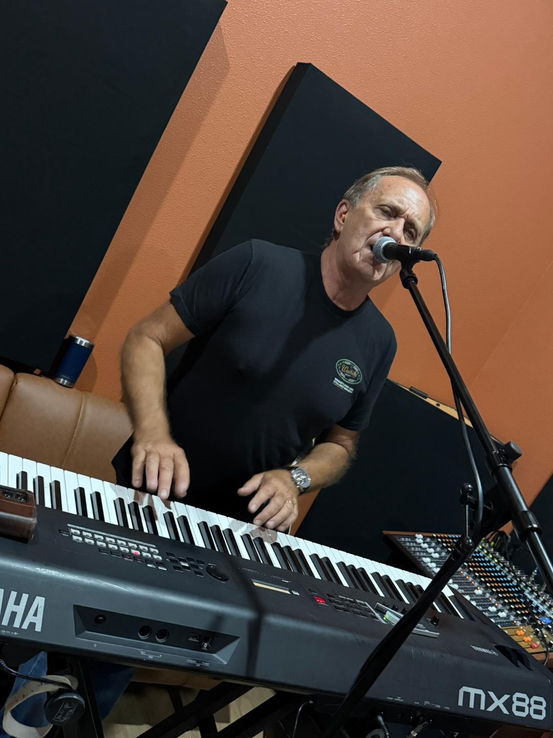Chris Sisson at keyboards and microphone in studio