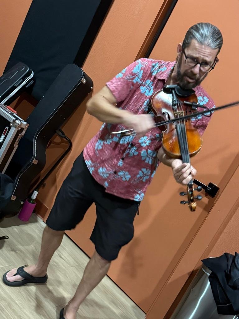 Jesse Allen Porter playing violin at rehearsal