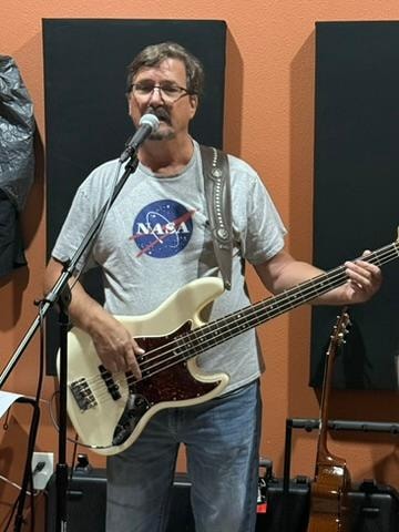 Lindsey White on bass guitar at rehearsal