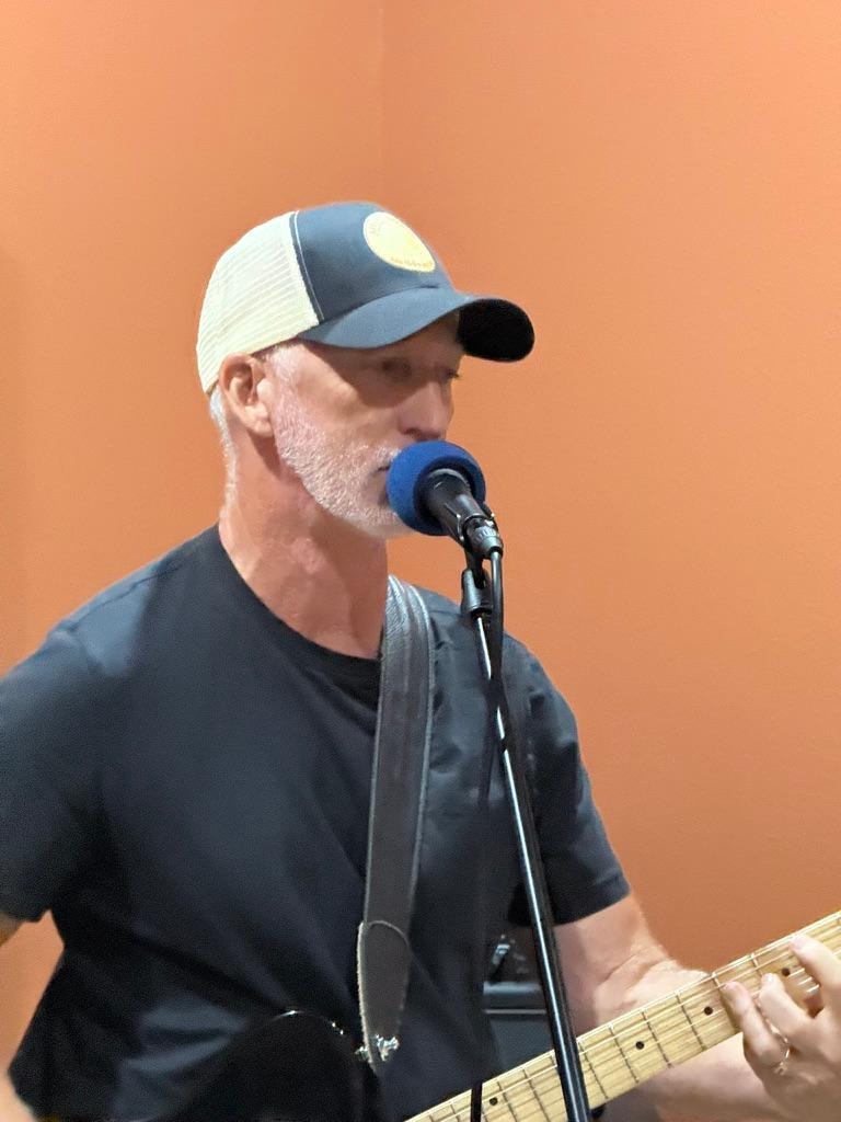 Michael Allen Miller close-up singing at microphone